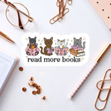 a sticker with a cat illustration and the text "read more books" on a white background. The sticker is surrounded by various office supplies, such as a pen, a pair of glasses, and some books.