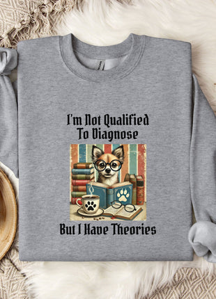 a gray sweatshirt with a graphic design depicting a dog wearing glasses and surrounded by books, along with the text "I'm Not Qualified To Diagnose" and "But I Have Theories".