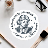 a sticker with a woman reading a book
