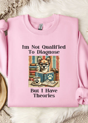 A pink sweatshirt with a humorous text and an illustration of a dog wearing glasses, sitting in front of a stack of books.