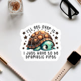 a sticker with a cartoon turtle and a humorous text that reads "I'll get over it, I just have to be dramatic first".