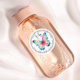 a close up of a bottle with a butterfly on it