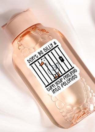 a clear bottle with a label that includes a cartoon duck and the text "Don't be silly & turn your feelings into pelonies".