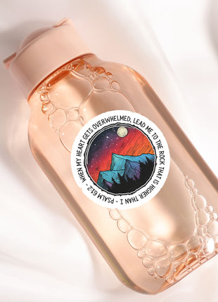 a close up of a bottle on a white surface