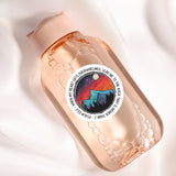a close up of a bottle on a white surface