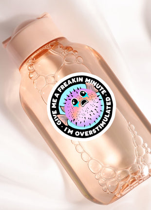 a close up of a bottle on a white surface