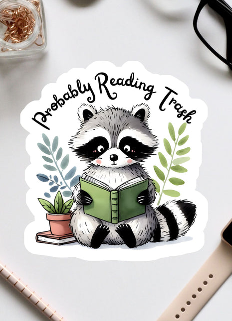 a raccoon reading a book while surrounded by office supplies