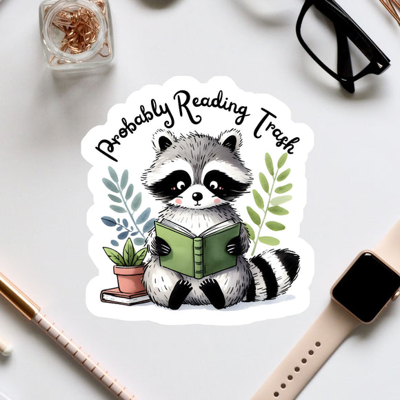 a raccoon reading a book while surrounded by office supplies