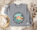A gray sweatshirt with a graphic design depicting a beach scene, along with the text "And to the beach I go, I lose my soul and my mind".