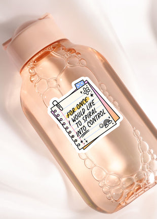 a bottle of hand sanitizer on a white surface
