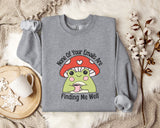 a gray sweatshirt with a cartoon frog wearing a red mushroom hat and holding a cup, accompanied by the text " none of your emails are finding me well".