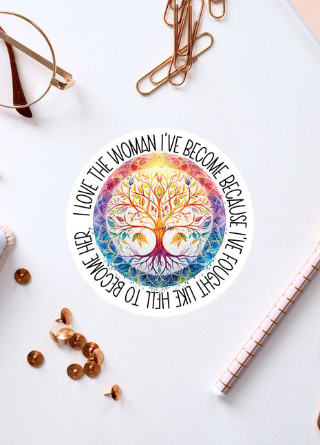 a white desk with various office supplies and a sticker with a tree design.
