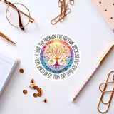 a white desk with various office supplies and a sticker with a tree design.