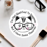 a sticker with a cat wearing glasses and surrounded by various office supplies, including a pair of glasses, a watch, and a pen.