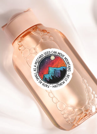 a bottle with a sticker on it sitting on a white surface