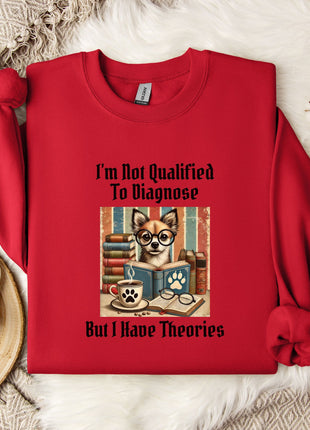 A red sweatshirt with a graphic design of a dog wearing glasses and surrounded by books, along with the text "I'm Not Qualified To Diagnose But I Have Theories".