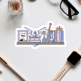 a sticker with a dragon, books, and a sign that says "I do not yield".