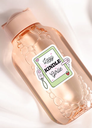 A bottle of "Lazy Kindle Girl" soap with a pink cap and a label featuring a pink heart and the text "Lazy Kindle Girl".