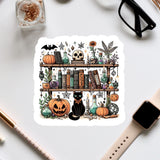 a sticker of a bookshelf with halloween decorations