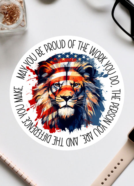 a circular sticker with a lion's face and an American flag design, surrounded by text that reads "May you be proud of the work you do, the person you are, and the difference you make".
