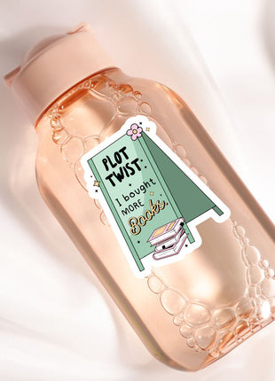 a bottle with a sticker on it sitting on a white surface