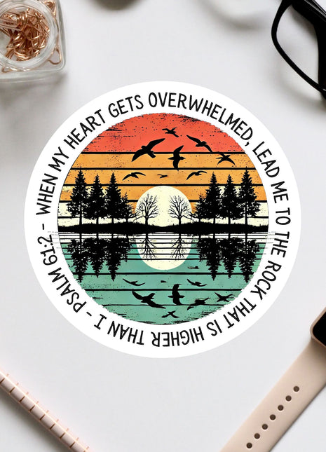 a circular design with a sunset and silhouetted trees scene, along with a Bible verse reference.