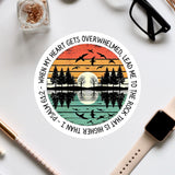 a circular design with a sunset and silhouetted trees scene, along with a Bible verse reference.