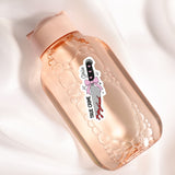 a bottle with a sticker on it sitting on a white surface