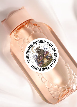 a pink bottle with a sticker of a dog on it