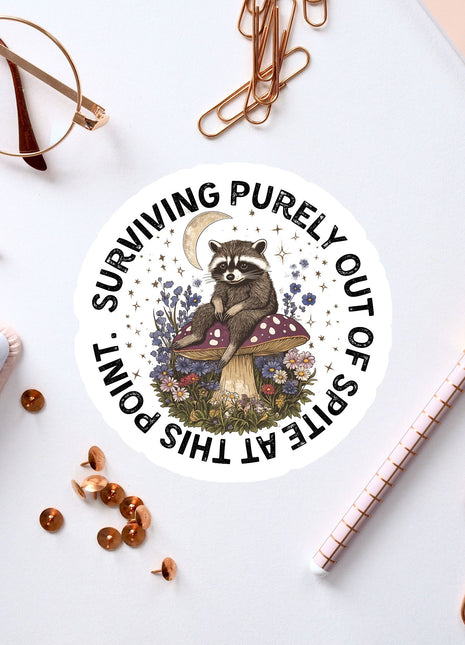 a sticker of a raccoon sitting on top of a table