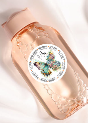 a pink bottle with a butterfly on it