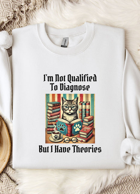 a white t-shirt with a humorous text and an illustration of a cat surrounded by books, placed on a bed with a white blanket and a mug.