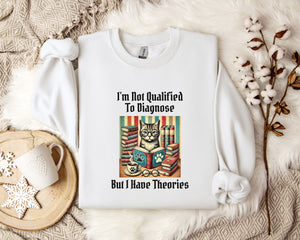 a white t-shirt with a humorous text and an illustration of a cat surrounded by books, placed on a bed with a white blanket and a mug.