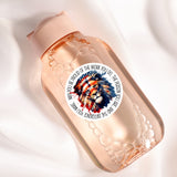 A clear glass bottle with a label featuring a lion's head and the text "You be proud of the work you do, the person you make it into".