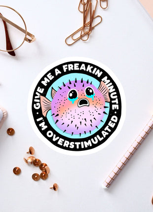 a sticker of a puffer fish on a white surface