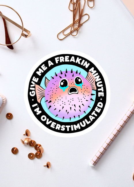 a sticker of a puffer fish on a white surface
