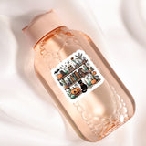 a bottle with a sticker on it sitting on a white surface