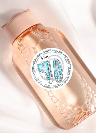 a close up of a bottle on a white surface