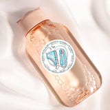 a close up of a bottle on a white surface
