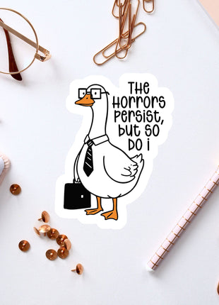 a sticker of a duck wearing glasses and a tie, surrounded by office supplies such as a pen, a notebook, and a pair of glasses.