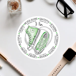 a sticker with a pair of green sneakers on it
