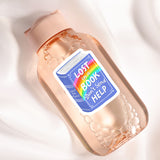 A pink bottle with a label that says "LOST IN A BOOK DON'T SEND HELP" and features a rainbow graphic.
