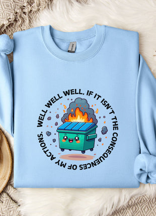A light blue sweatshirt with a graphic design featuring a cartoon trash can with flames coming out of it, surrounded by a circular design with the text "WELL WELL, IF IT ISN'T THE CONSEQUENCES OF MY ACTION".