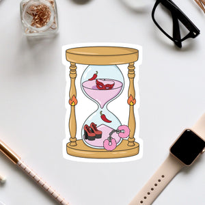 a sticker of an hourglass with a pink liquid inside, surrounded by various objects such as a pair of glasses, a watch, and a pen.