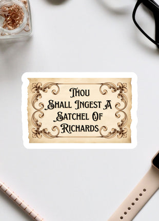 a sticker with a quote, surrounded by various office supplies and accessories such as a pen, a watch, and a pair of glasses.