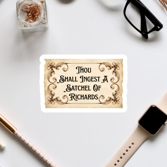 a sticker with a quote, surrounded by various office supplies and accessories such as a pen, a watch, and a pair of glasses.