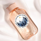 a close up of a bottle on a white surface