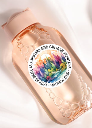 a bottle with a picture of a forest on it