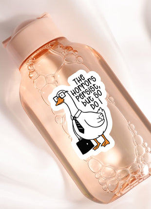 A pink bottle with a sticker featuring a cartoon goose wearing a tie and holding a briefcase.
