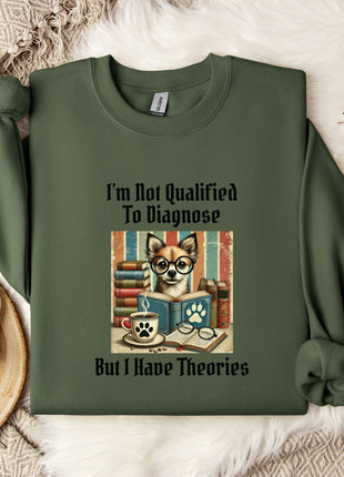 a green sweatshirt with a printed design of a dog wearing glasses and surrounded by books, along with the text "I'm Not Qualified To Diagnose But I Have Theories".